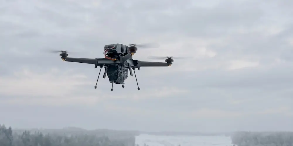 Drone in flight above a snowy landscape